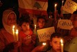 D�l-Libanonb�l elmenek�lt n�k �s gyerekek eml�keznek meg a bomb�zott falvakr�l