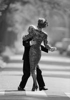 mature couple dancing in street